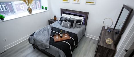Modern, relaxing, comfy bedroom. Wireless speaker also included.