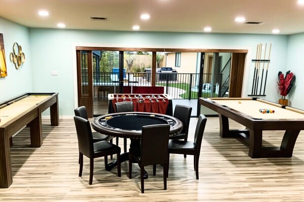Game On! Epic game room where endless entertainment. Pool Table, Shuffle Board, Foosball, Poker table, Arcade and more...