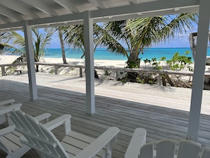 Sea Biscuit's porch and deck overlooks the turquoise sea.