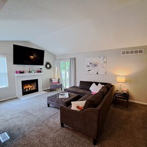 Spacious living room with cathedral ceilings