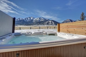 Relax in the 6 person hot tub with water feature, lights, and jets