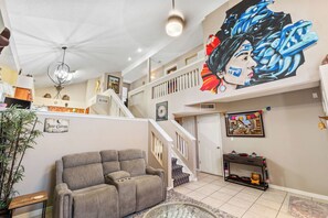Living area with Mural showcasing house