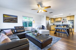 Beautiful living room furnishings!  Quality leather sofa with head rests.  Smart flat screen wall-mounted.