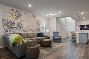 Amazing Living Room Area with Tinkerbell Decor and Flat Screen TV