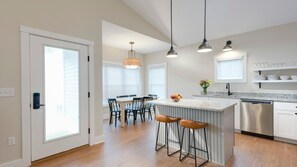 A well-equipped full-size kitchen and dining room is part of the open concept.