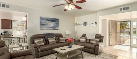 Bright and spacious living with reclining sofa, love seat and chair.  