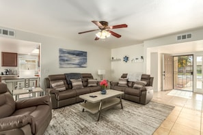 Bright and spacious living with reclining sofa, love seat and chair.