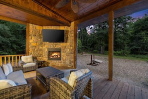 Savor the warmth of the fire and the company of loved ones as you unwind with a glass of wine by the outdoor fireplace.