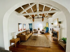 Open air, bohemian living room.  Fireplace is decorative and not functional.