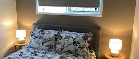 Comfy large bed with all linen provided. 2 lamps and 2 windows.