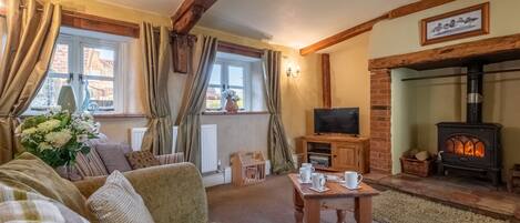 Church Cottage, Castle Acre: A cosy country cottage sitting room