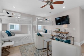 Bunk room with 2 sets of built-in full over-full bunk beds, and a built-in Murphy bed (sleeps 2) making the sleep count for this bunk room 10!