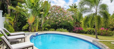 Beautiful pool and landscaped gardens await