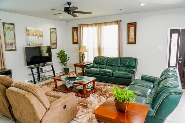 Family Area with comfy leather sitting,  60" Smart Roku TV