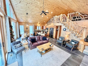 Relax in the Great room w/ plenty of comfy seating, fireplace, TV & river views!