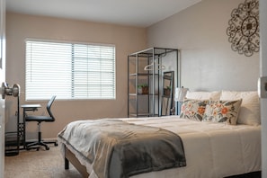 Down stairs bedroom with Queen Bed, 55 inch TV, Desk and Chair