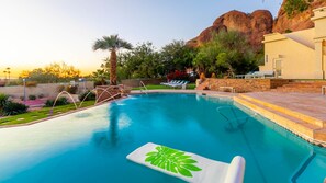 Infinity saltwater pool w/ water feature, mountain background & sunset views