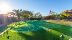 Sunny backyard putting green for even more outdoor fun