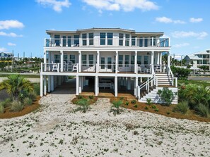 The front faces unobstructed natural sand dunes with ocean views.  