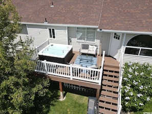 Patio with Hot Tub. The back door enters the kitchen/dinning room