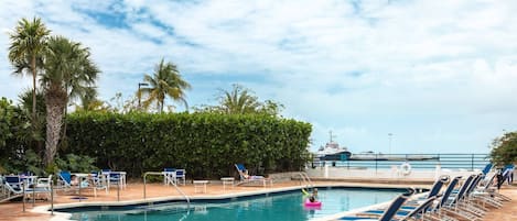 Indulge in a refreshing escape as you cool off in the pool while soaking in picturesque views of the Key West harbor.