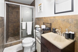 Basement floor full-bathroom, stocked with necessities