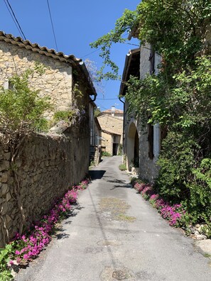 View down the street from the parking area; house is on the left 