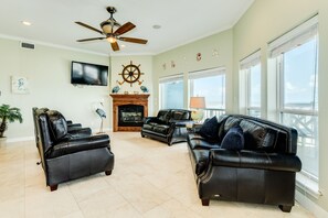 Wall of windows showcase beachfront views