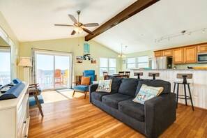 Bright and airy living room showcasing beachfront views