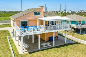 Expansive partially covered deck with panoramic Gulf views