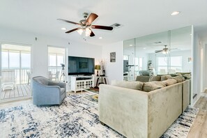 Bright and airy living area with beachfront views