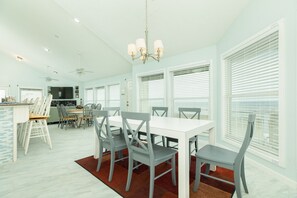 Enjoy meals overlooking the Gulf from two dining tables - sure to fit the whole group!