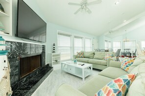 Abundant, comfortable seating in the bright and airy living room