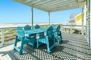 Dine al fresco and watch dolphins swim in the Gulf