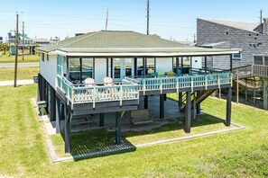 Expansive deck with plenty of seating options at this beachfront home