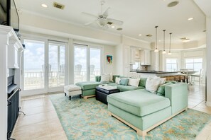 Bright and airy living area with wall of windows showcasing the great views