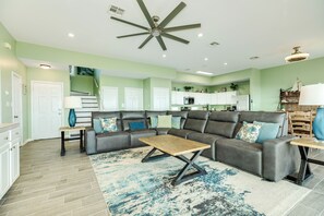 Abundant comfortable seating in the bright and airy living room