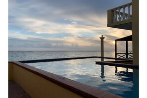 Private pool sunset overlooking the beautiful ocean