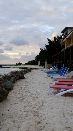 Our beach right off your deck, sun loungers for your use. 