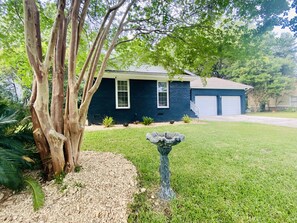 Front yard and private driveway that fits 4 cars.