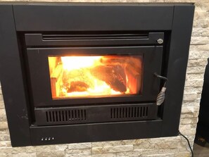 This fireplace will be sure to keep the entire house warm during the cooler months. We also have other heating options on this home. 