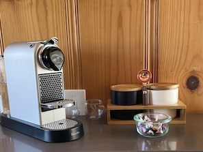 First. Things. First. You will have coffee and Nespresso pods provided.