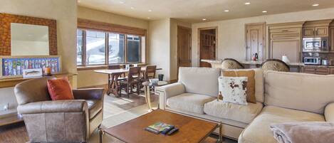 Living room with Kitchen and dining room in background