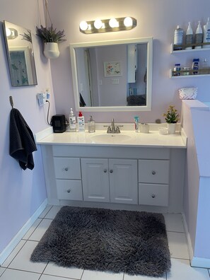 Lots of space on the counter and drawers.  Along with oversized mirror