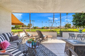 Back Patio is Shaded and has Outdoor Dining and Fire Feature