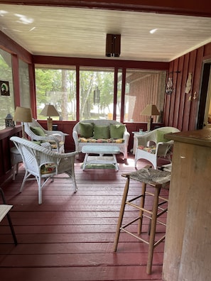 Screened-in porch with bar