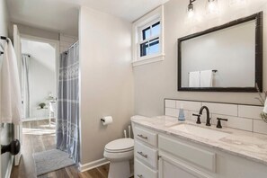 Get ready for the day ahead in style in our well-appointed bathroom, offering ample space and all the modern touches to help you look and feel your best