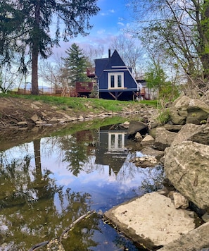 View of the chalet from the brook which meanders through large private lot