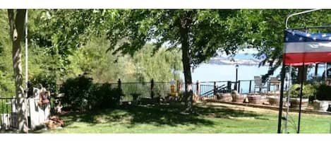 Your private, fenced backyard is right on the water with your fishing/boat dock.