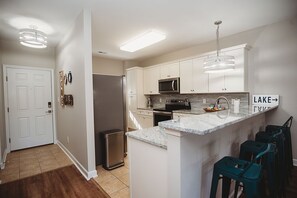 Recently updated fully equipped kitchen with stainless appliances.